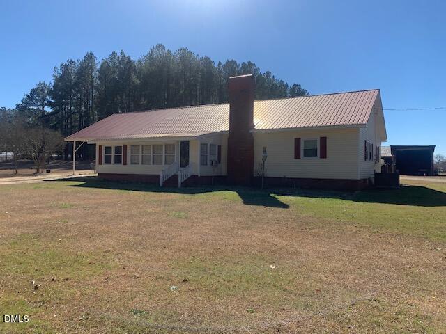 1527 Hardee Road Fuquay-Varina, NC 27526 - Photo 2 of 9 a house view with a swimming pool and garden
