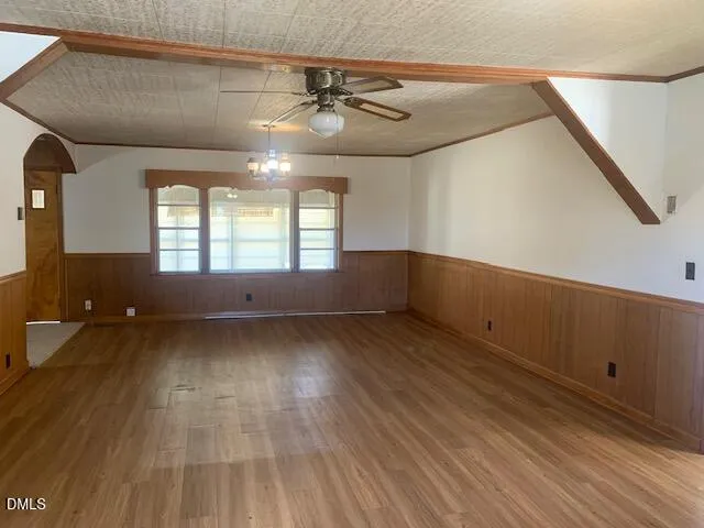 a view of wooden floor and windows in a room