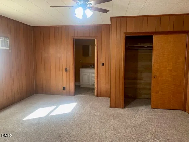 an empty room with closet area