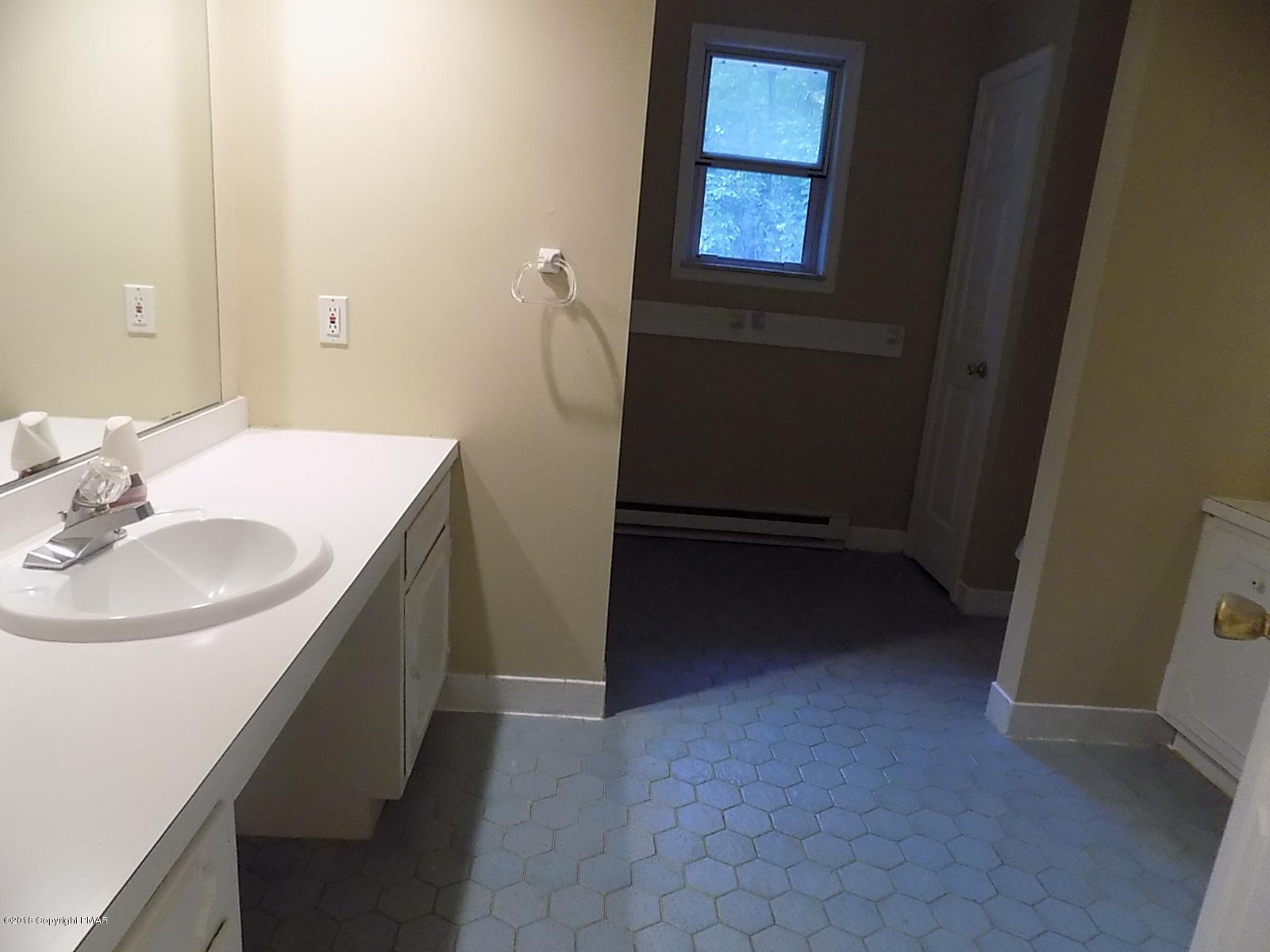1151 Browning Road East Stroudsburg, PA 18301 - Photo 13 of 19 a bathroom with a sink a vanity and a mirror