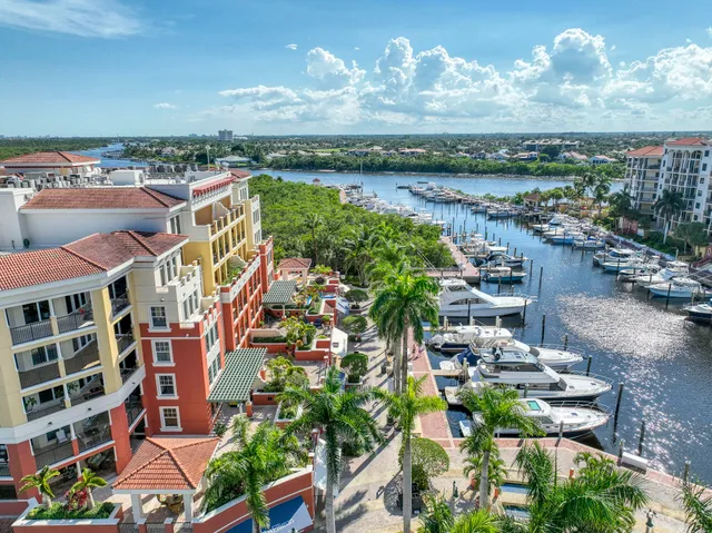 an aerial view of residential houses with outdoor space and swimming pool