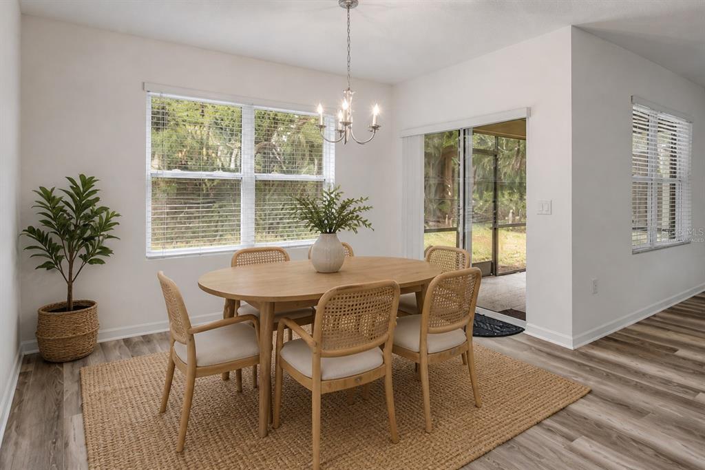 353 Admiralty Court Edgewater, FL 32141 - Photo 11 of 56 a view of a dining room with furniture window and outside view