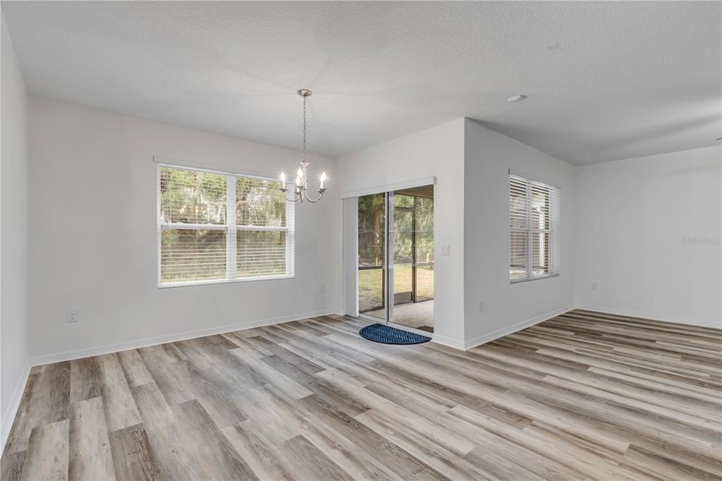 353 Admiralty Court Edgewater, FL 32141 - Photo 12 of 56 a view of empty room with wooden floor and fan