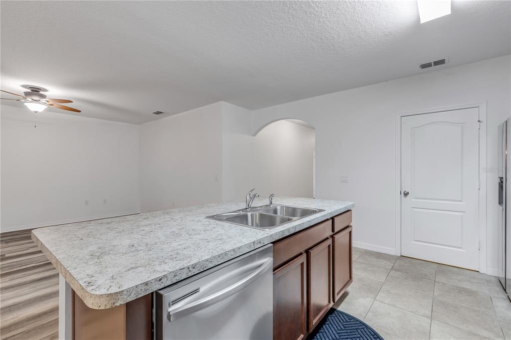 353 Admiralty Court Edgewater, FL 32141 - Photo 20 of 56 a kitchen with a sink and cabinets