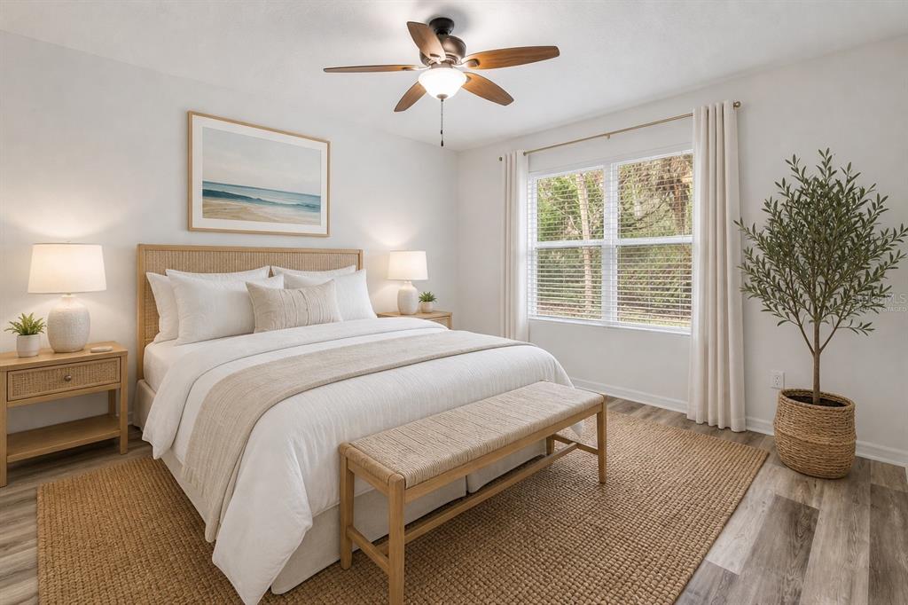 353 Admiralty Court Edgewater, FL 32141 - Photo 30 of 56 a bedroom with a bed and a potted plant