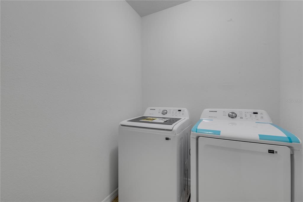 353 Admiralty Court Edgewater, FL 32141 - Photo 37 of 56 a utility room with dryer and washer