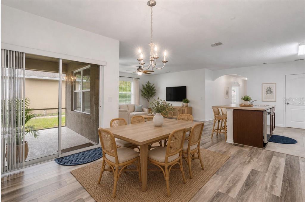 353 Admiralty Court Edgewater, FL 32141 - Photo 8 of 56 a view of a dining room with furniture and chandelier