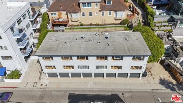 a front view of a building with a lot of windows