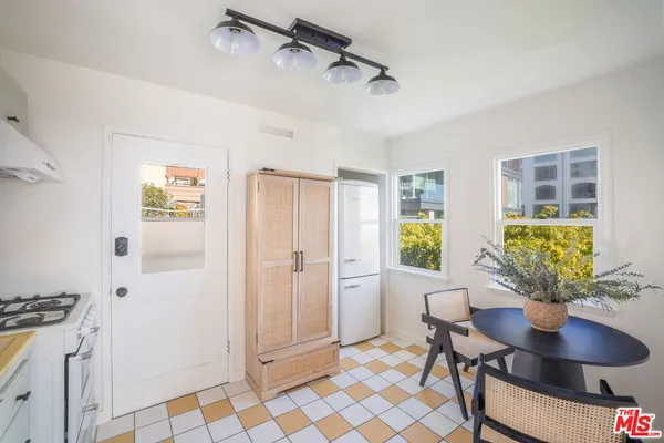 a spacious kitchen with stainless steel appliances kitchen island granite countertop a sink and cabinets
