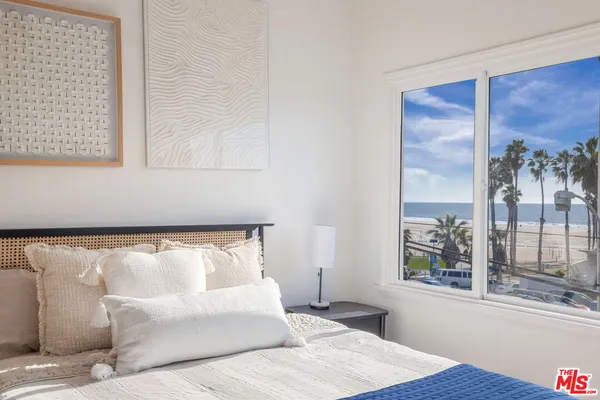 a bedroom with a bed and a table