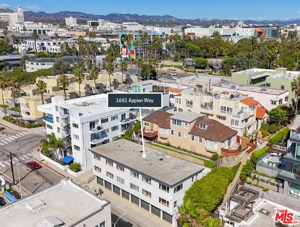 an aerial view of a building with an outdoor space