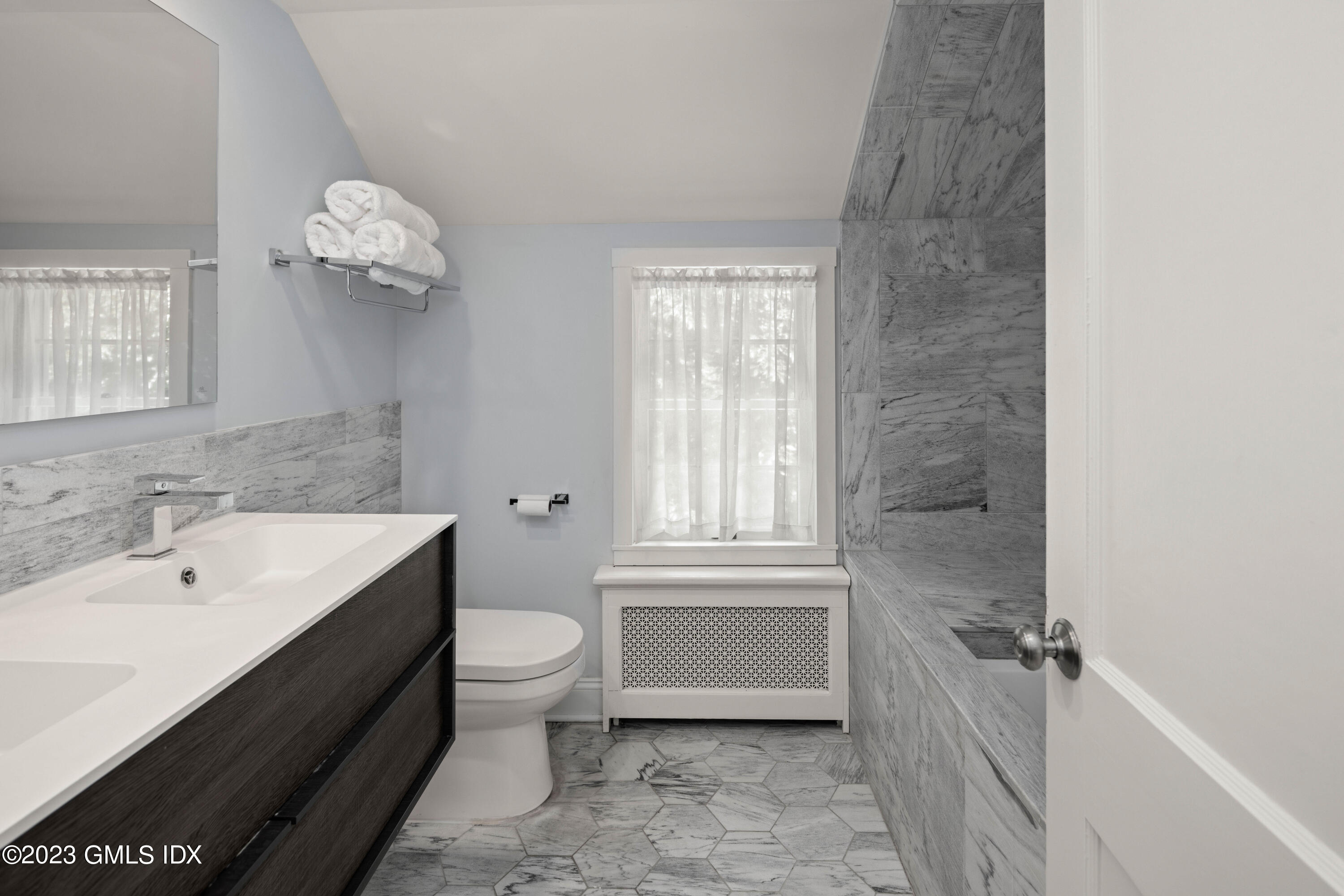 29 Indian Mill Road Cos Cob, CT 06807 - Photo 30 of 44 a bathroom with a sink a toilet and a bathtub