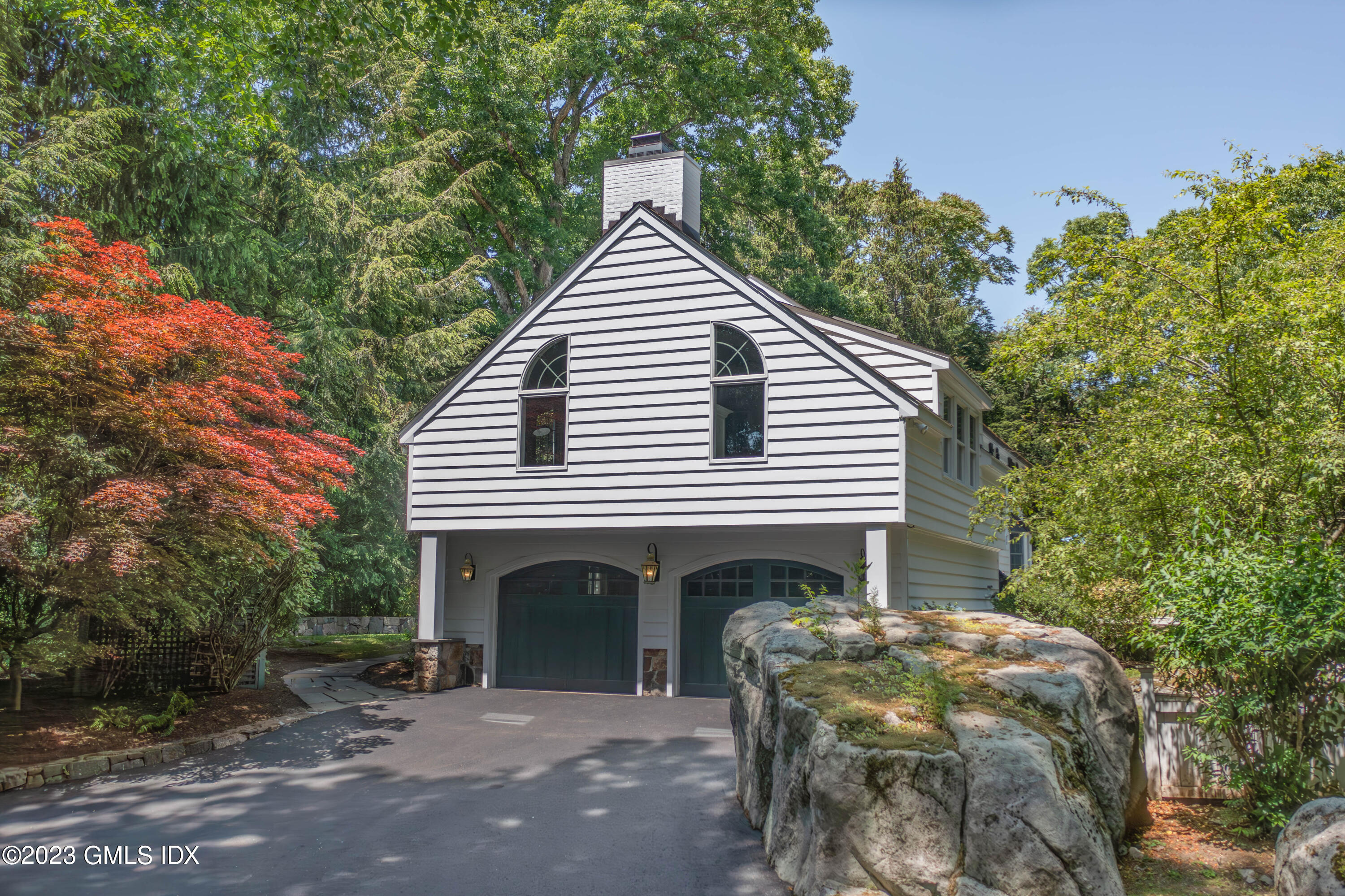 29 Indian Mill Road Cos Cob, CT 06807 - Photo 41 of 44 a front view of a house with a garden