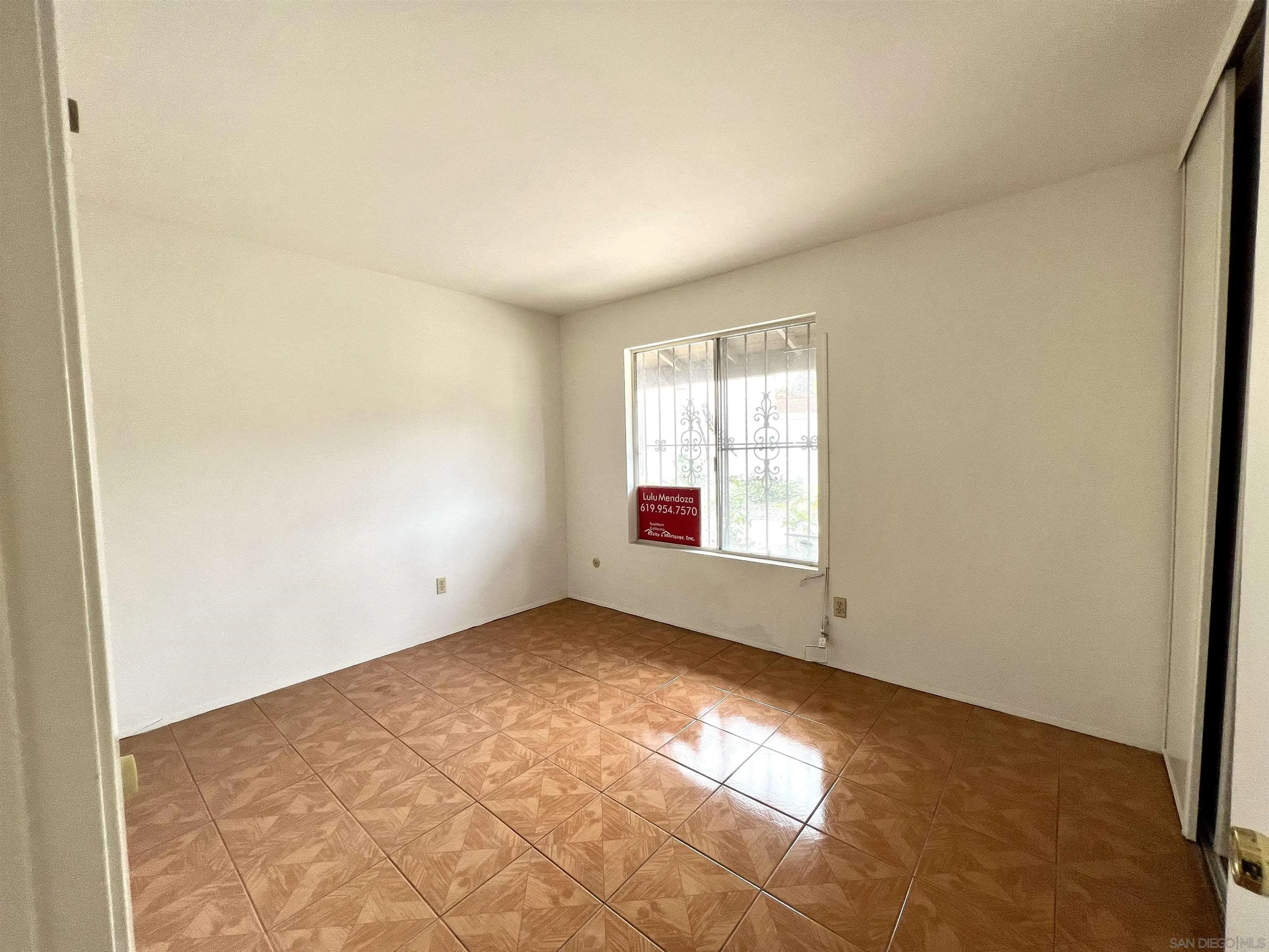 444 Bluffview Road Spring Valley, CA 91977 - Photo 13 of 34 an empty room with windows