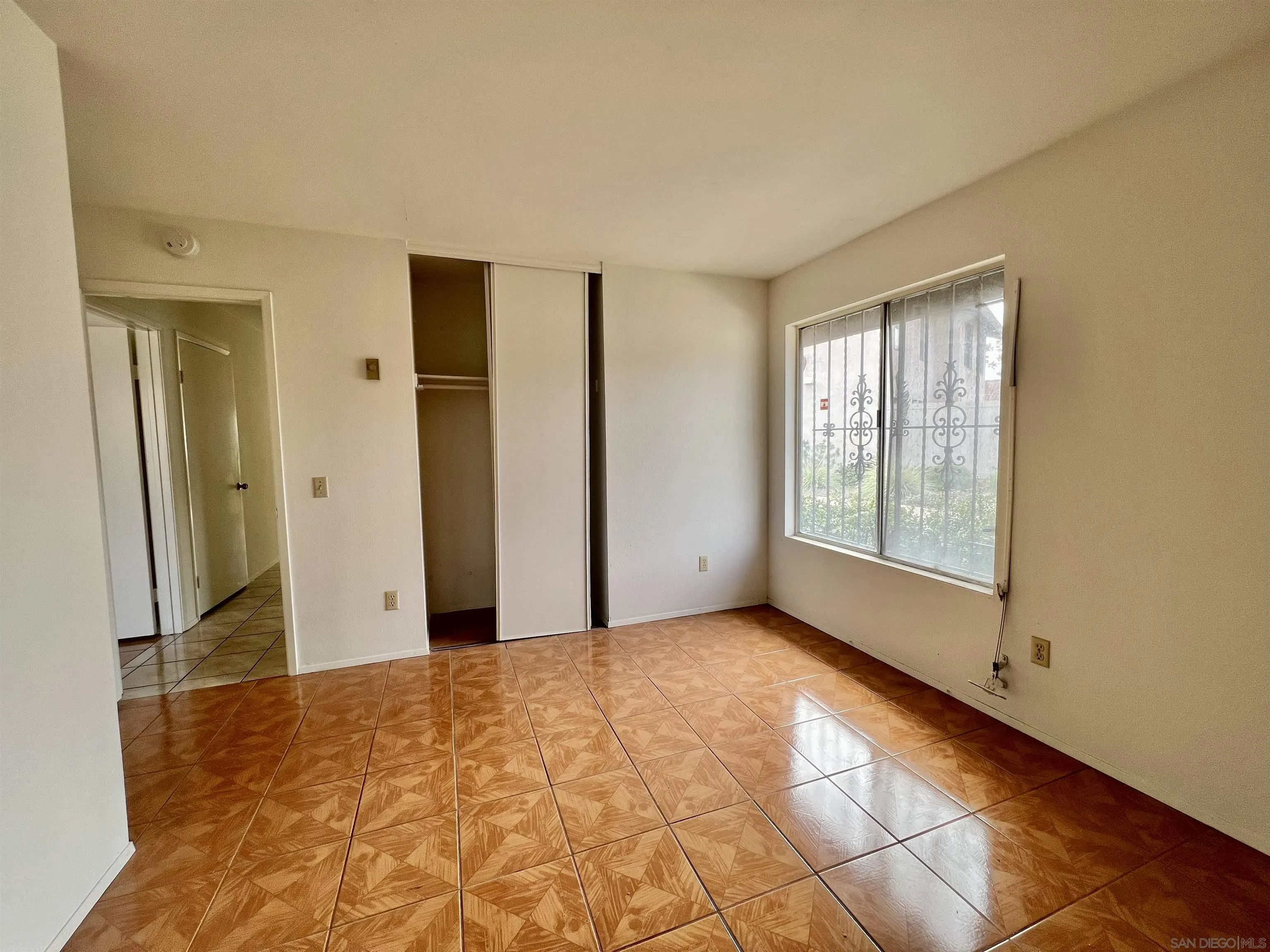 444 Bluffview Road Spring Valley, CA 91977 - Photo 16 of 34 a view of an empty room with window and a bathroom