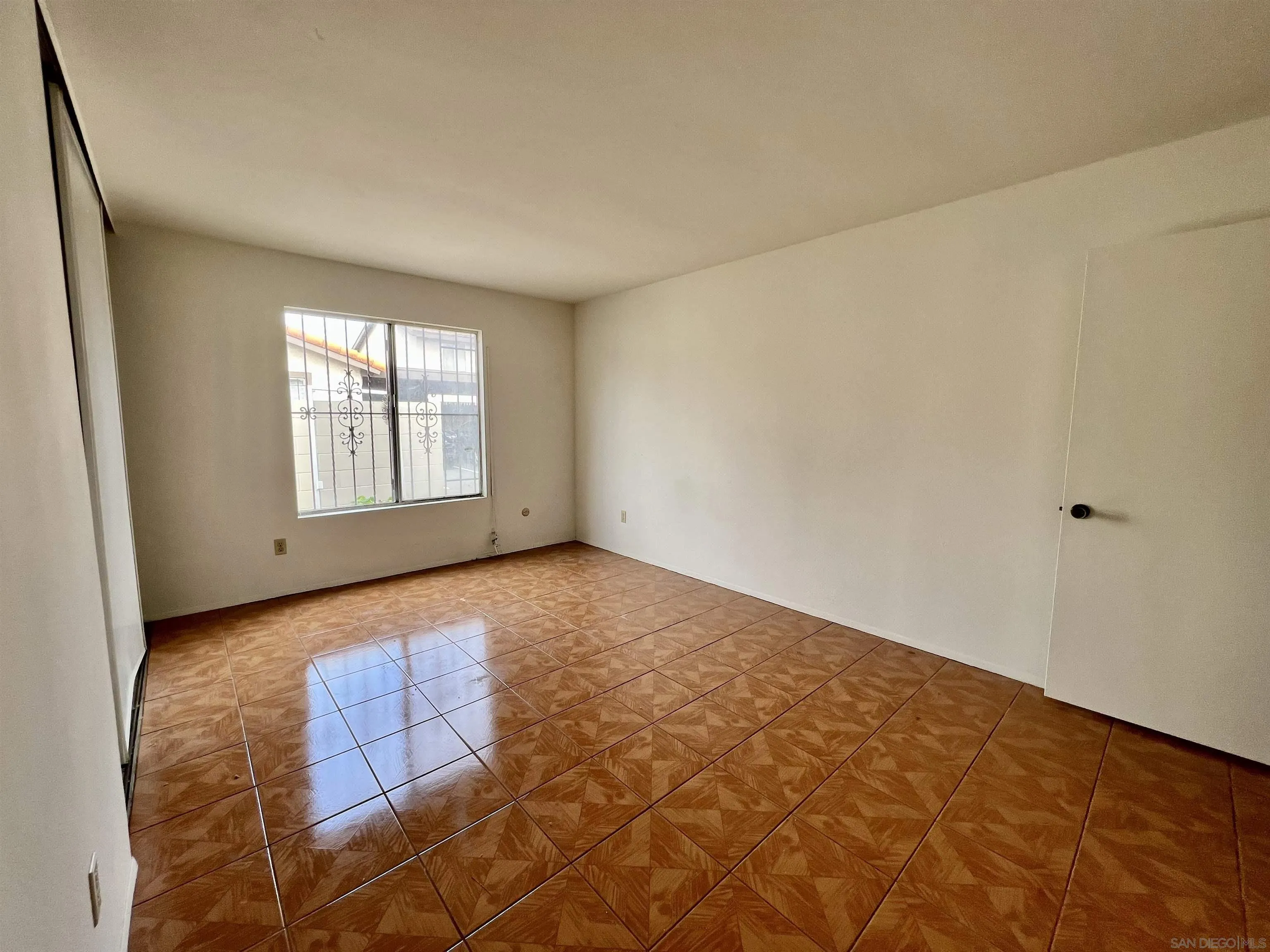 444 Bluffview Road Spring Valley, CA 91977 - Photo 18 of 34 an empty room with windows