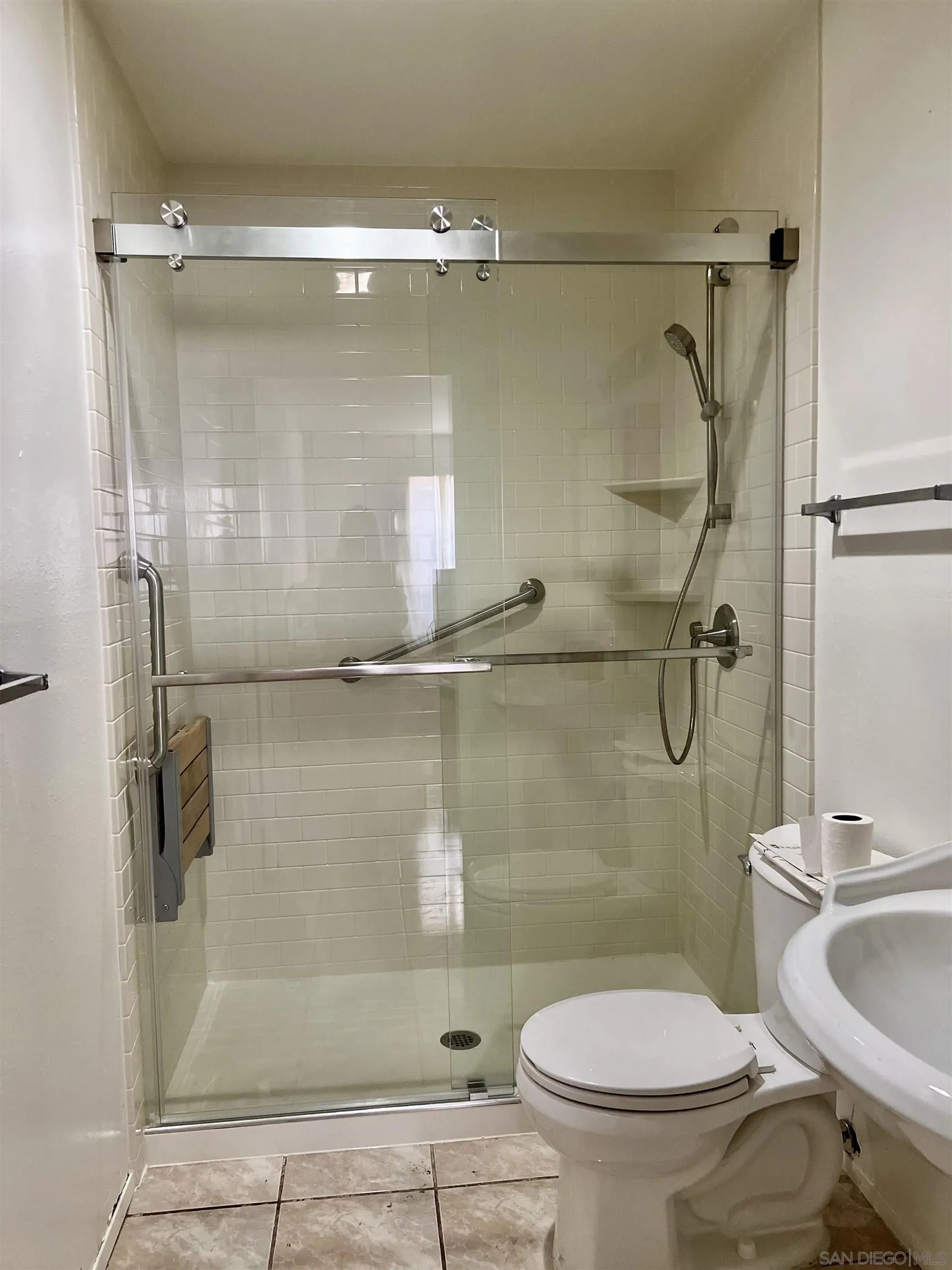 444 Bluffview Road Spring Valley, CA 91977 - Photo 19 of 34 a bathroom with a granite countertop toilet a sink and shower