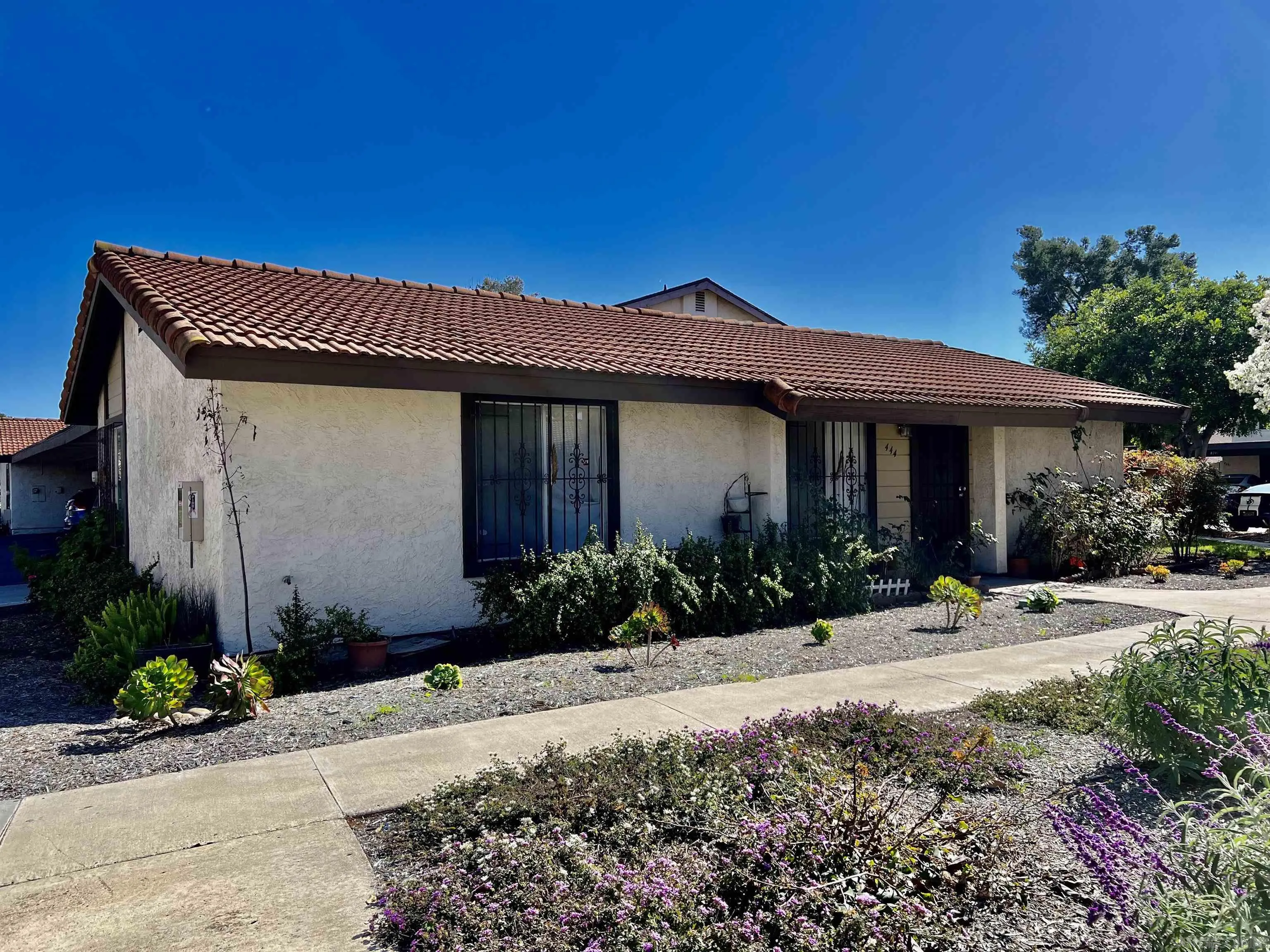444 Bluffview Road Spring Valley, CA 91977 - Photo 3 of 34 a front view of a house with a yard
