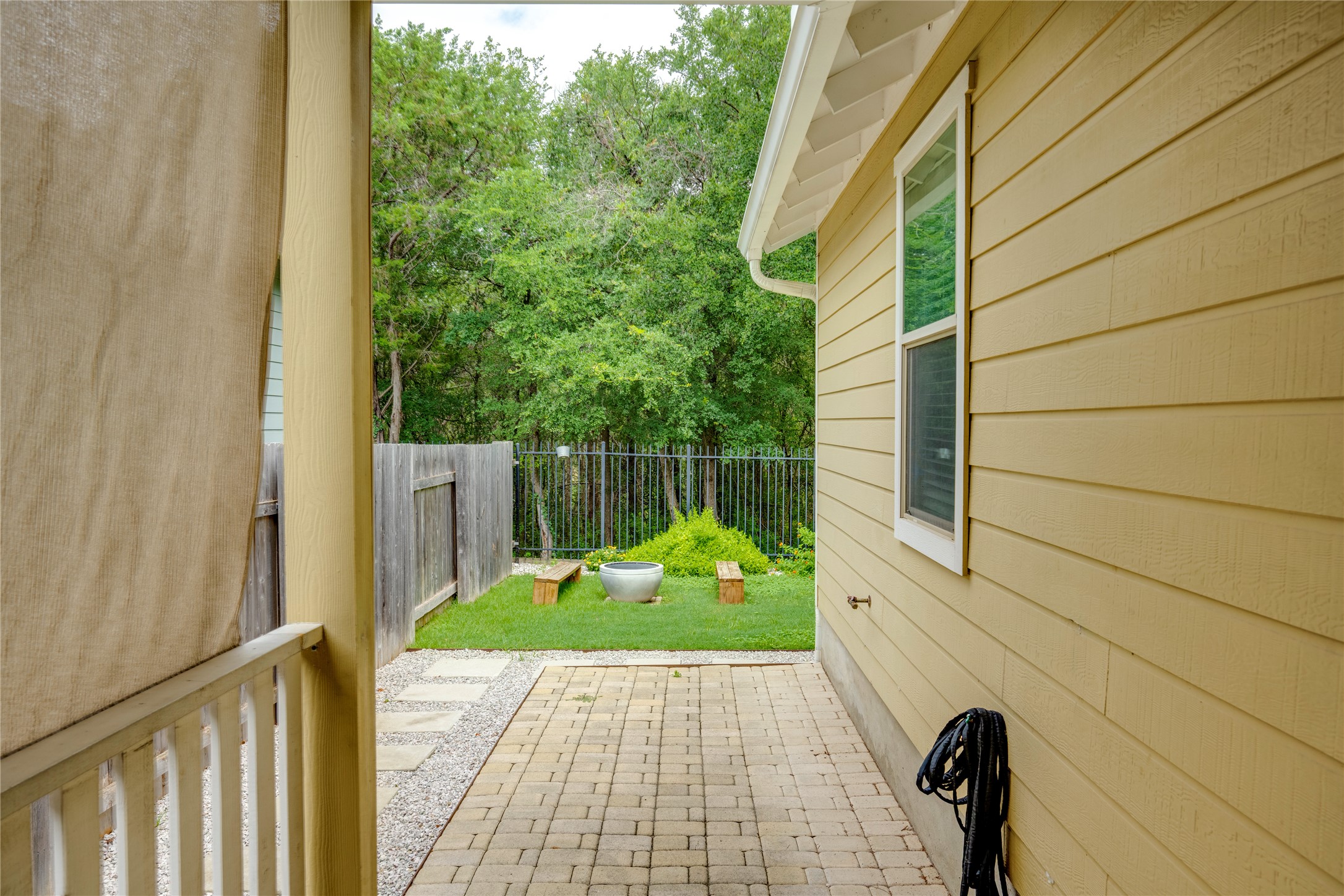 6008 Whipple Way Austin, TX 78745 - Photo 32 of 39 A private backyard retreat featuring a paver patio and verdant landscaping.