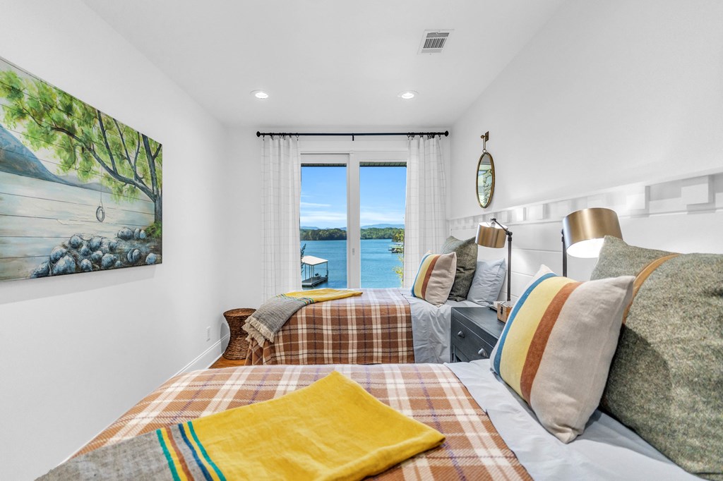 703 Cherokee Hill Road Hiawassee, GA 30546 - Photo 16 of 23 a bedroom with furniture and a window