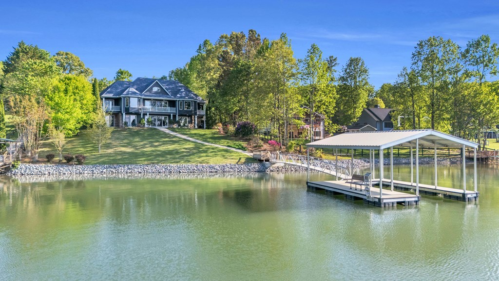 703 Cherokee Hill Road Hiawassee, GA 30546 - Photo 20 of 23 a view of a lake with a house swimming pool and outdoor space