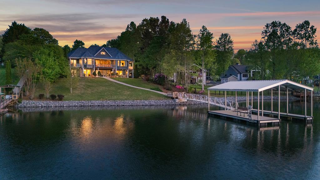 703 Cherokee Hill Road Hiawassee, GA 30546 - Photo 22 of 23 a view of a lake with a house swimming pool and outdoor space