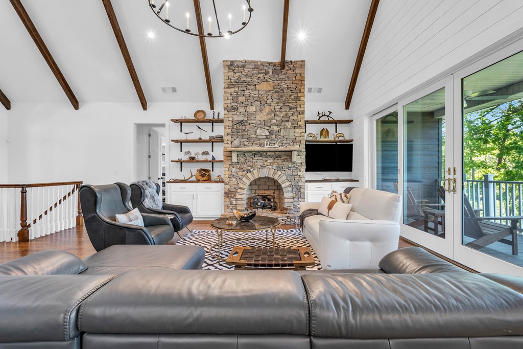 703 Cherokee Hill Road Hiawassee, GA 30546 - Photo 3 of 23 a living room with fireplace furniture and a flat screen tv