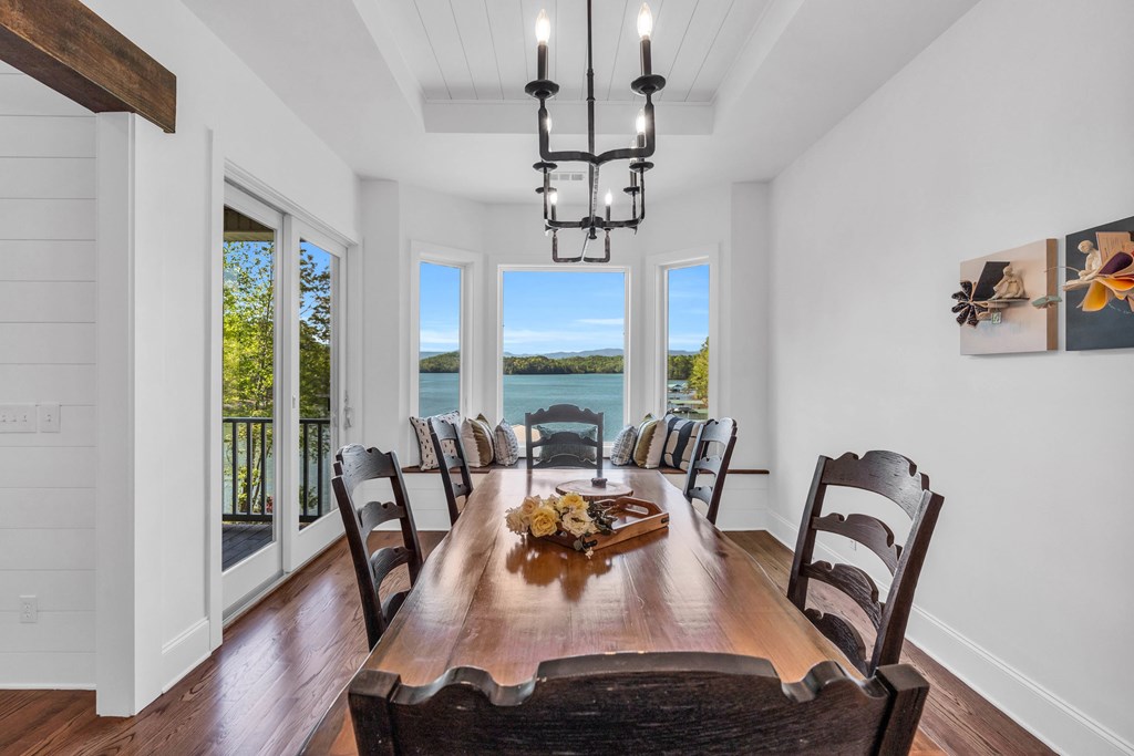 703 Cherokee Hill Road Hiawassee, GA 30546 - Photo 4 of 23 a view of a dining room with furniture window and wooden floor