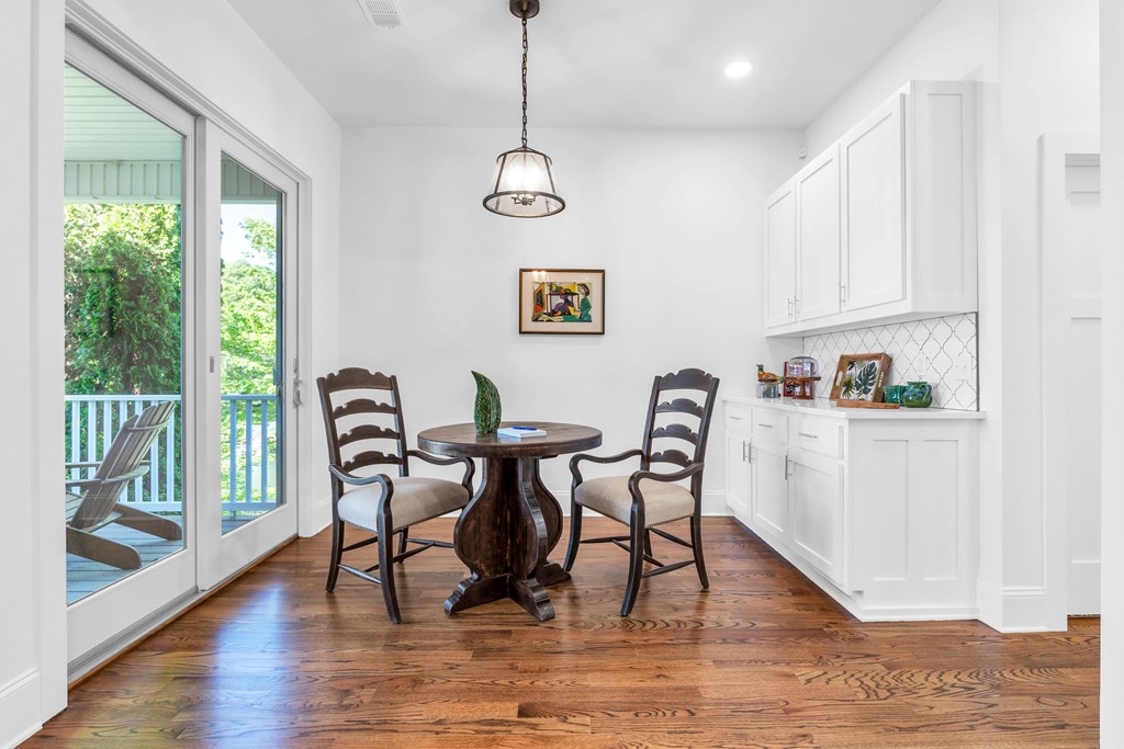 703 Cherokee Hill Road Hiawassee, GA 30546 - Photo 6 of 23 a view of a dining room with furniture window and wooden floor