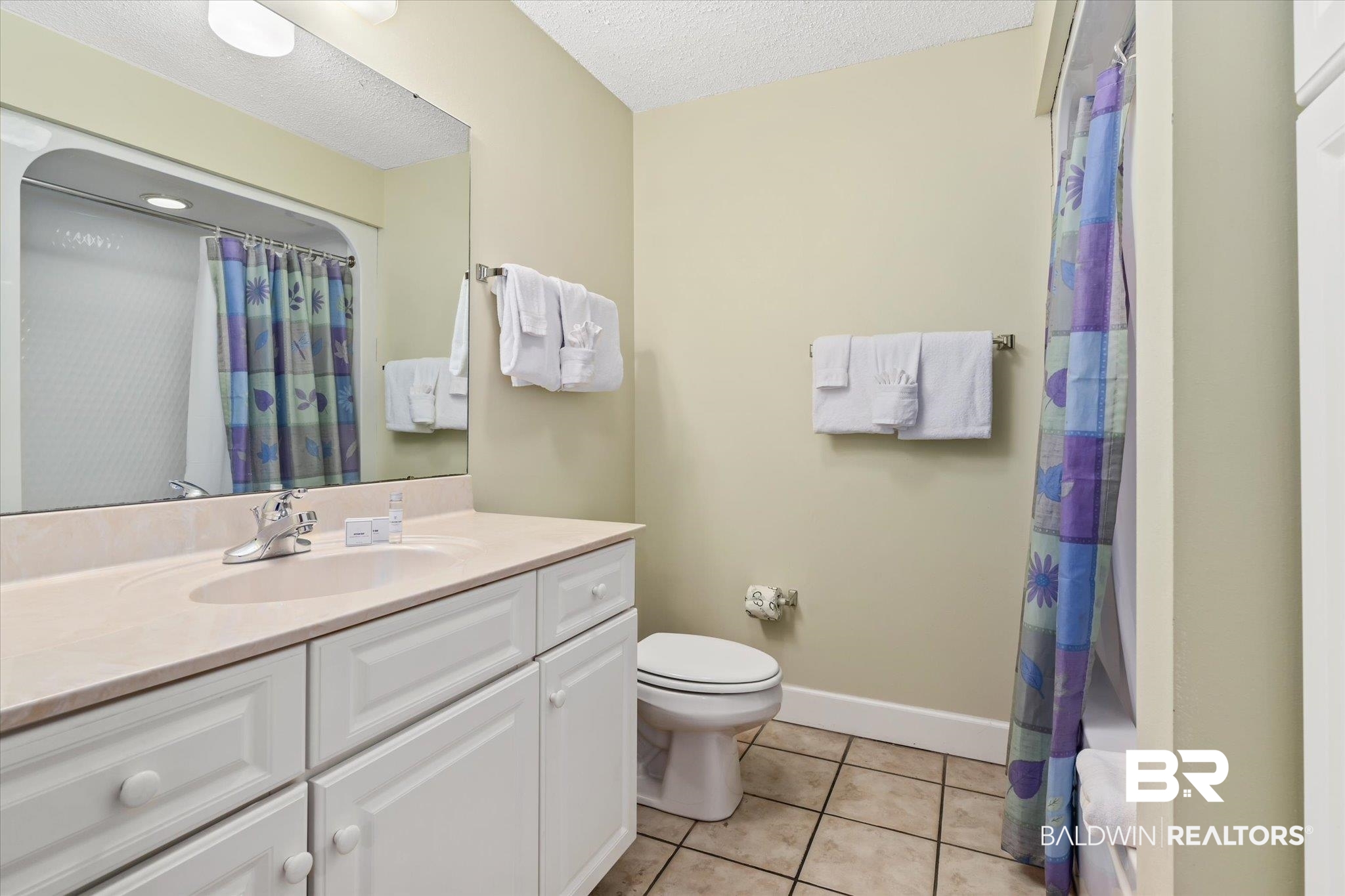 27580 Canal Road, Unit 1322 Orange Beach, AL 36561 - Photo 17 of 30 Bathroom with toilet, walk in shower, tile patterned floors, vanity, and a textured ceiling