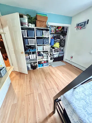 a bedroom with double bunk beds and a window