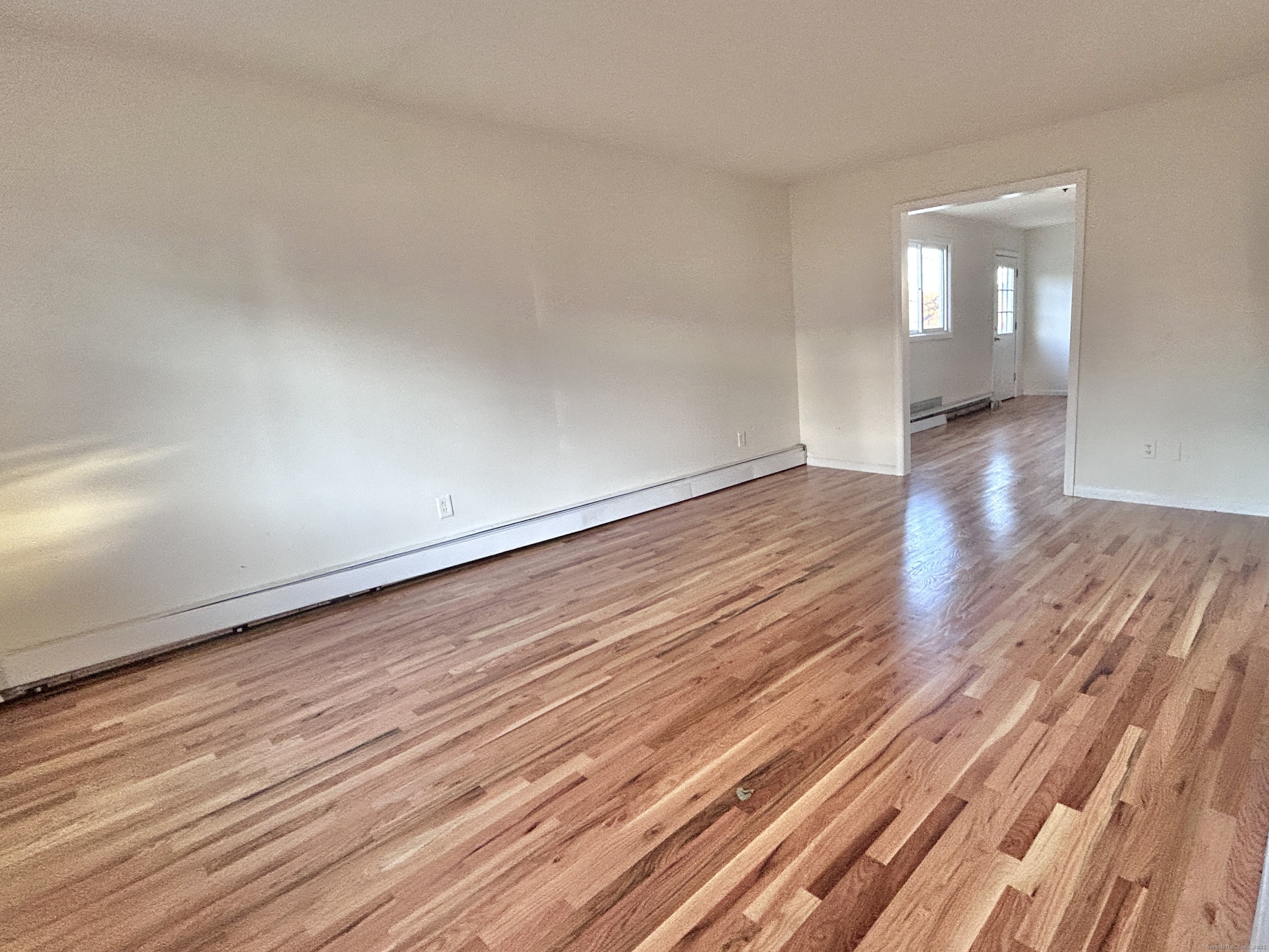 106 Howard Avenue Ansonia, CT 06401 - Photo 24 of 38 LIVING ROOM INTO KITCHEN