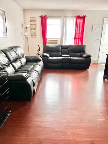 a living room with furniture and a table