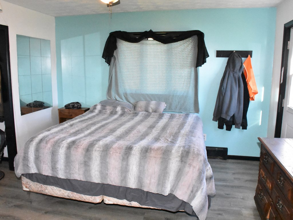 18823 Carlskin Road Cochranton, PA 16314 - Photo 17 of 27 a bedroom with a bed and a walk in closet