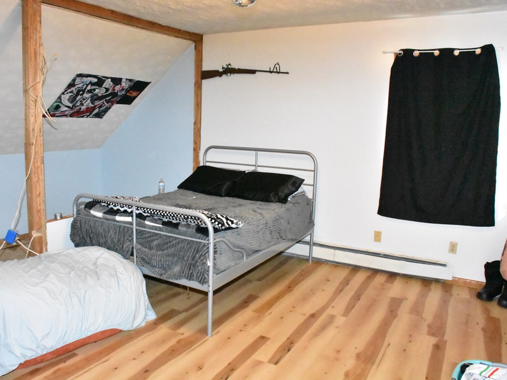 18823 Carlskin Road Cochranton, PA 16314 - Photo 20 of 27 a bedroom with a bed and a flat tv screen on dresser