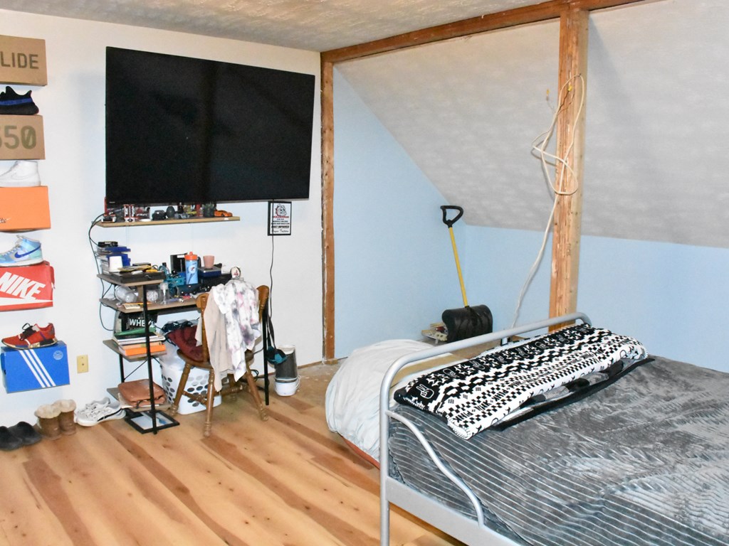 18823 Carlskin Road Cochranton, PA 16314 - Photo 21 of 27 a bedroom with a bed and a flat screen tv