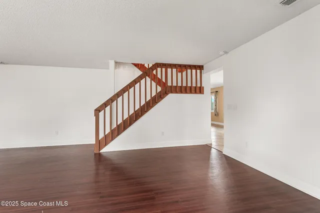 a view of entryway with wooden floor