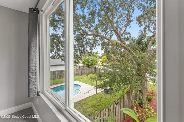 a bathroom with a granite countertop sink a toilet a mirror and shower