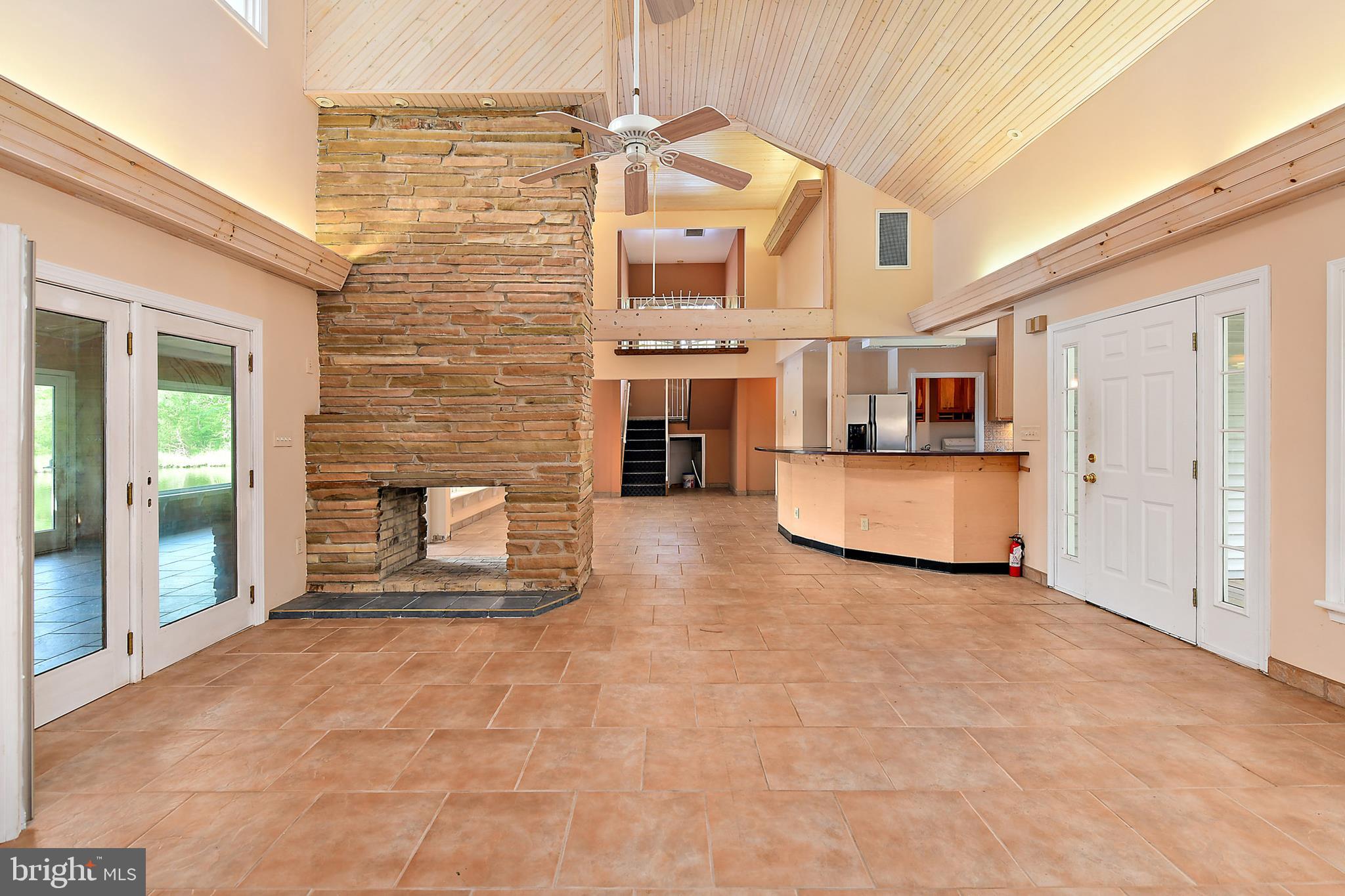 9502 Croppers Island Road Newark, MD 21841 - Photo 25 of 46 FOYER: 2-SIDED STONE FIREPLACE