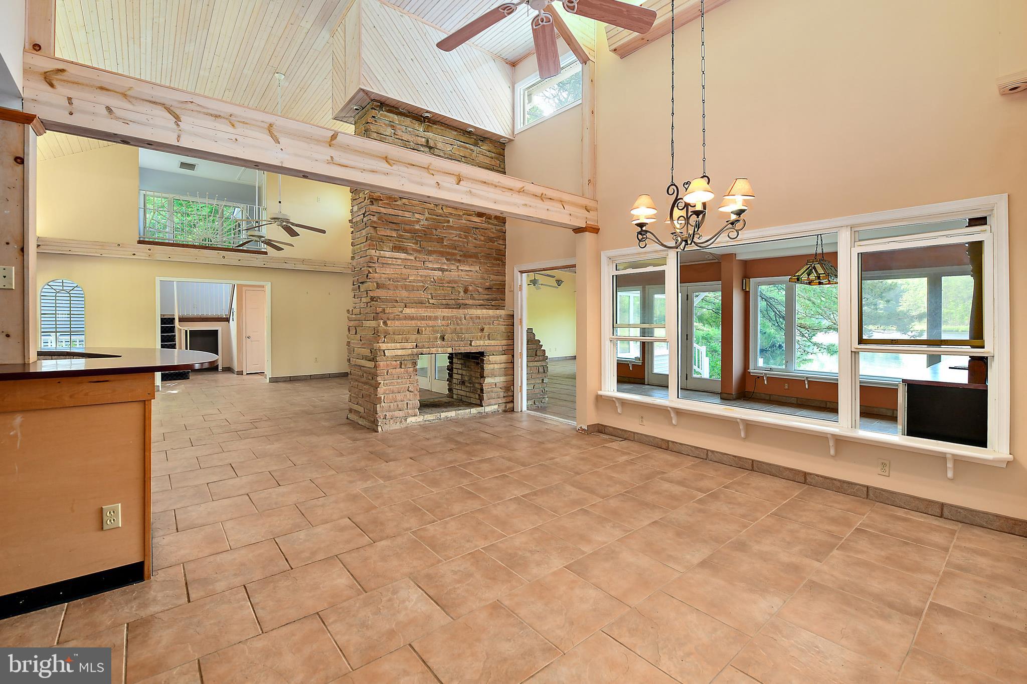 9502 Croppers Island Road Newark, MD 21841 - Photo 30 of 46 DINING ROOM: 2-SIDED STONE FIREPLACE