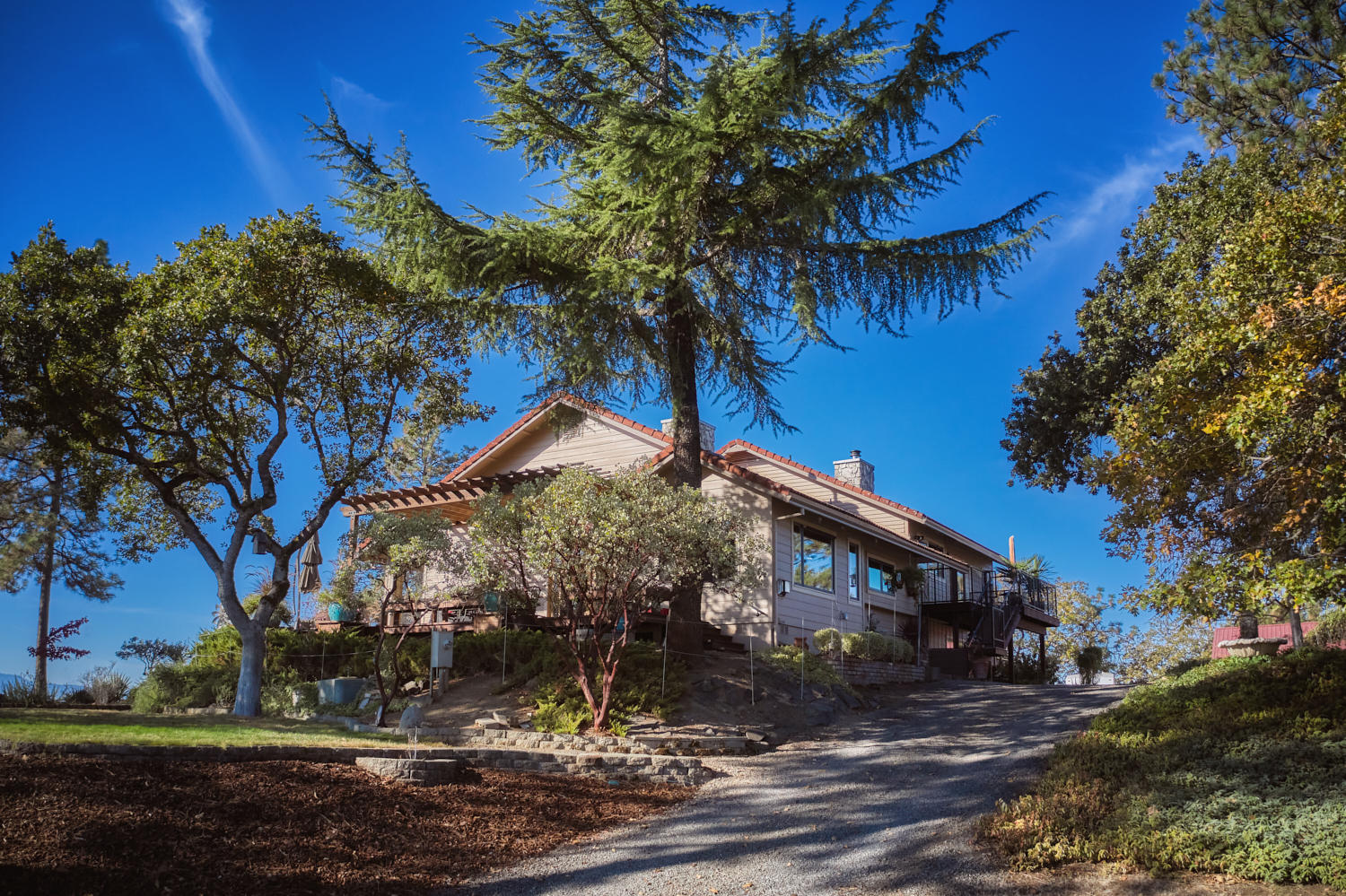 150 Nick Young Road Eagle Point, OR 97524 - Photo 3 of 41 a front view of a house with garden