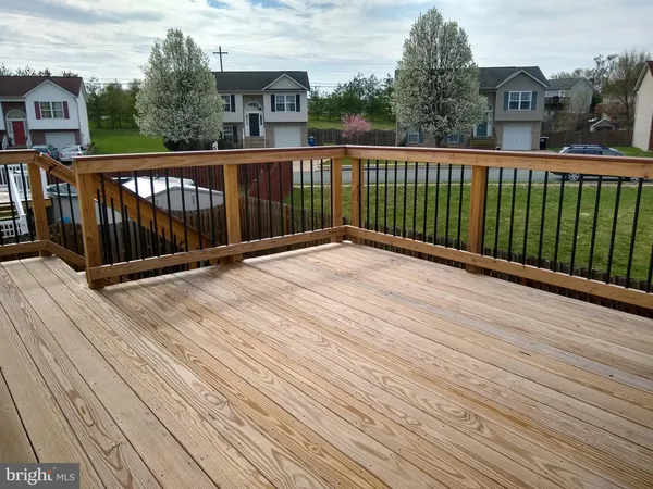 a view of a house with a yard and stairs