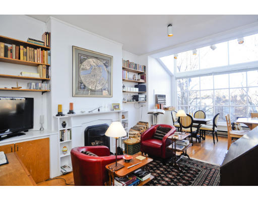 a living room with fireplace furniture and a flat screen tv