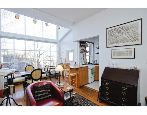 31 Pinckney Street, Unit 4B Boston, MA 02114 - Photo 2 of 5 a living room with furniture and a window