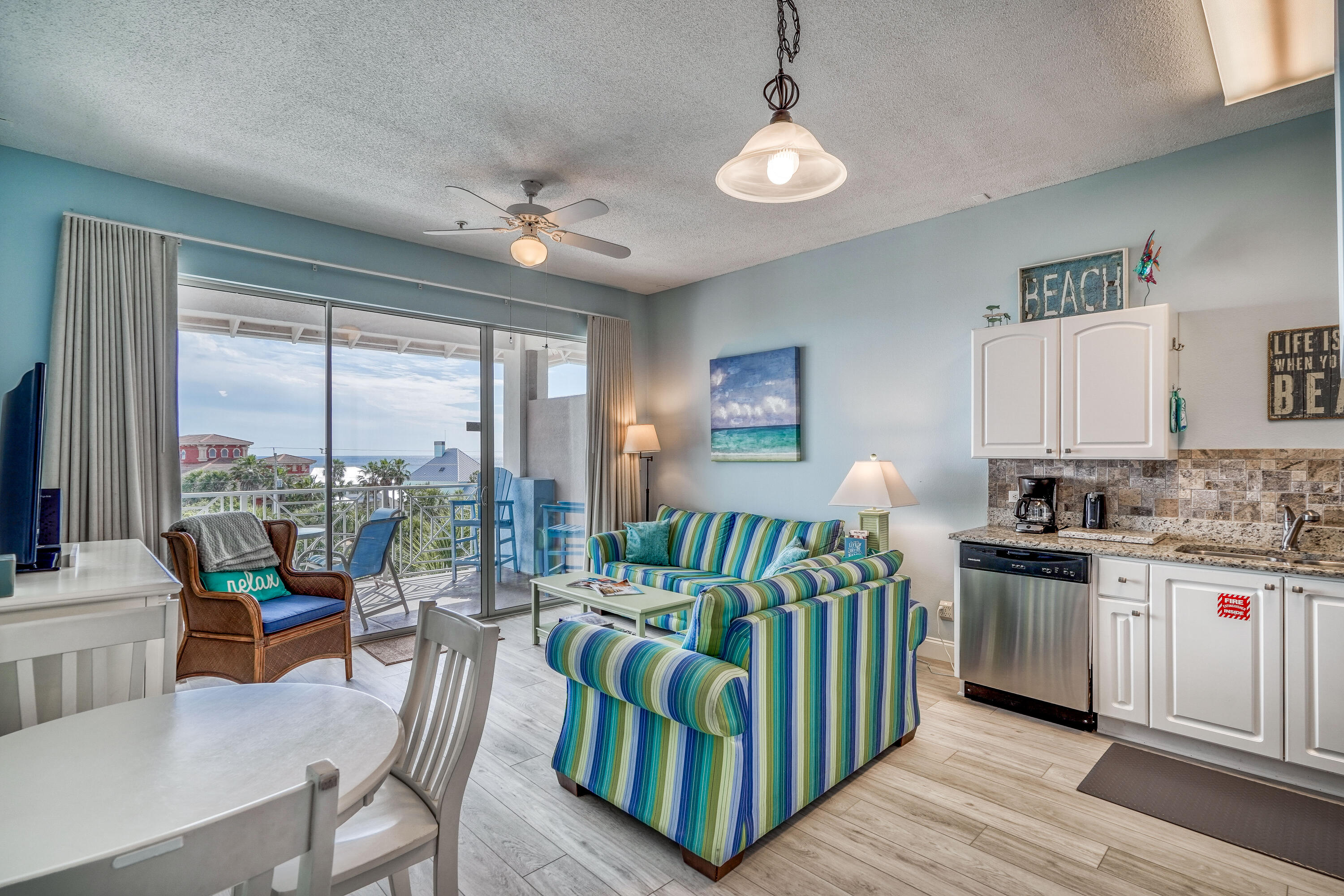145 Spires Lane, Unit 406 Santa Rosa Beach, FL 32459 - Photo 3 of 38 a living room with furniture and a large window