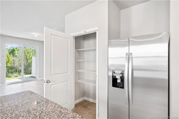 a bathroom with a shower and a glass door