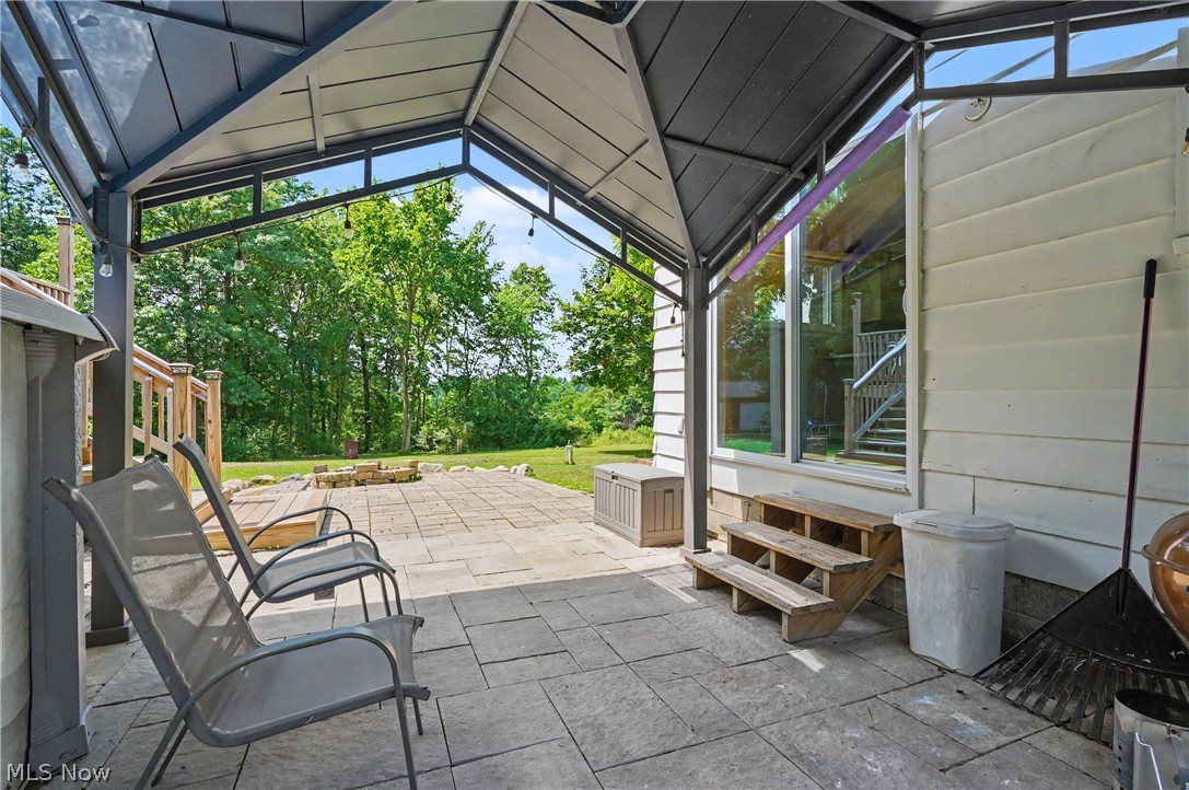 952 Ravenna Road Kent, OH 44240 - Photo 22 of 37 Expansive patio area w/ covered trellis ready for you to enjoy!