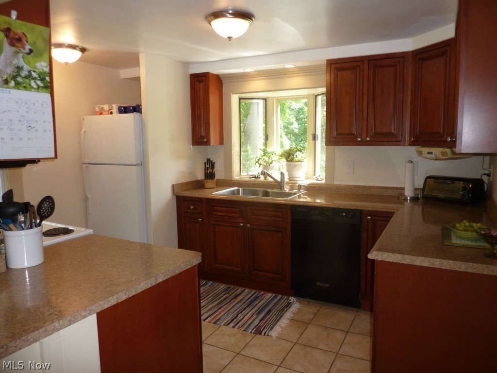 Beautifully Updated Cherry Kitchen, Newer Counters, All Appliances, Bayed Plant Shelf Above the Kitchen Sink and a Small Pantry Cubbie Next to the Stove!