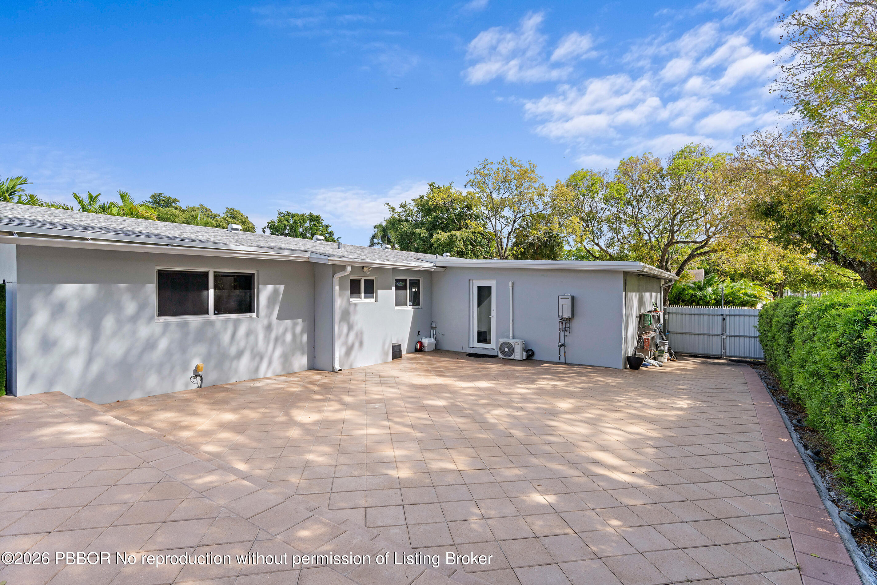 747 Avon Road West Palm Beach, FL 33401 - Photo 23 of 29 a backyard of a house with table and chairs