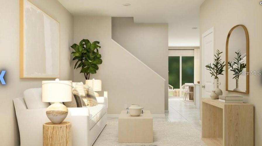 2667 Skyline Loop Kissimmee, FL 34758 - Photo 5 of 13 a living room with furniture and potted plant